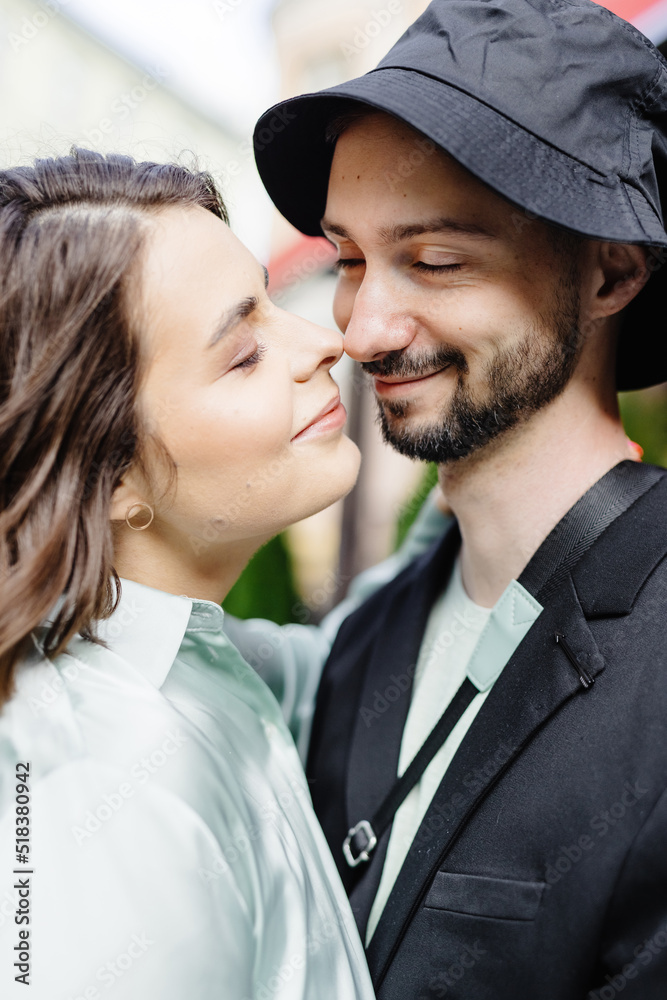 Charming brunette girl trying touching to nose of her partner Charming brunette girl trying touching to nose of her partner