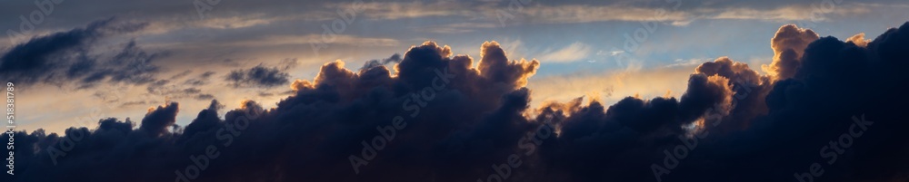 Obraz premium Sky panorama. Beautiful dramatic big clouds in the sky. Landscape of the power of heaven and nature. Copy space