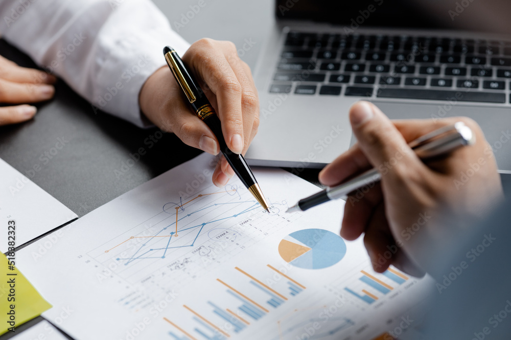 Naklejka premium Two businessmen pointed to the material for the meeting, working together to plan to develop and solve common business problems. Concept of business management for growth and quality.
