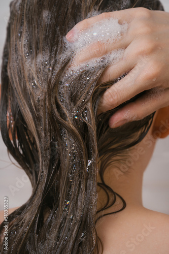 Closeup of the female washing her hair