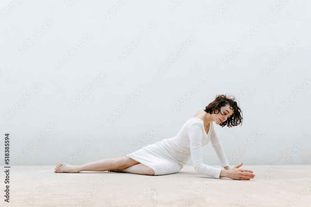 Woman touching floor during dance