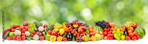 Bright multi-colored berries  fruits and vegetables on green