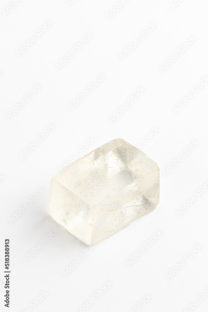 Icelandic Spar Crystal on White Background. Calcite. Viking Sunstone. Iceland treasures Icelandic Spar Crystal on White Background. Calcite. Viking Sunstone. Iceland treasures