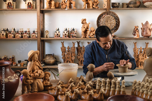 Artisan working with clay photo