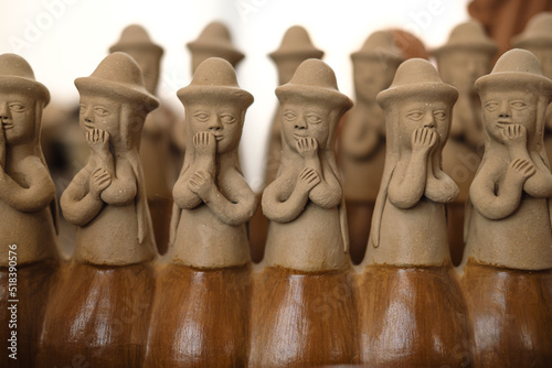 traditional ceramic of woman gossiping photo