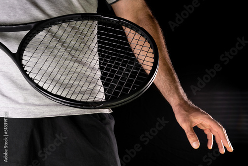 Tennis.Man holding a racket for tennis