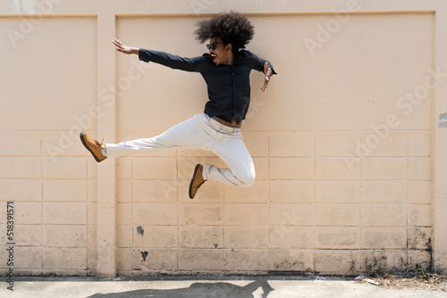 Gen z guy jumps on the street photo