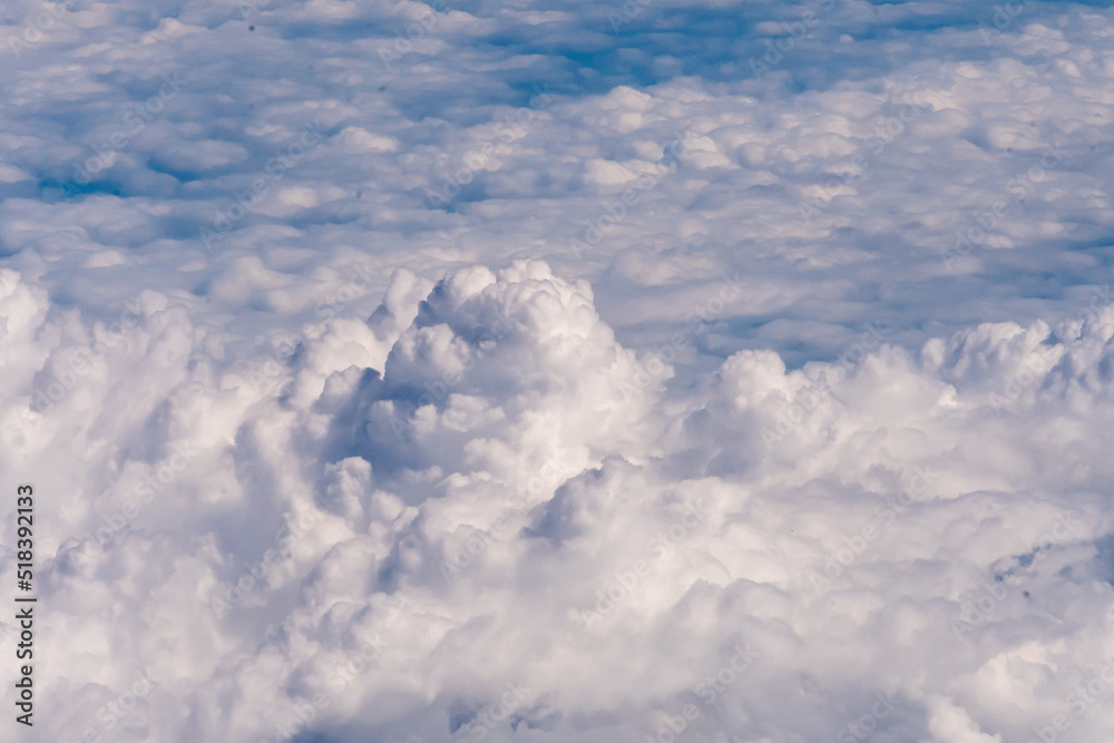 Clouds outside my airplane window from a comfortable cruising altitude Clouds outside my airplane window from a comfortable cruising altitude