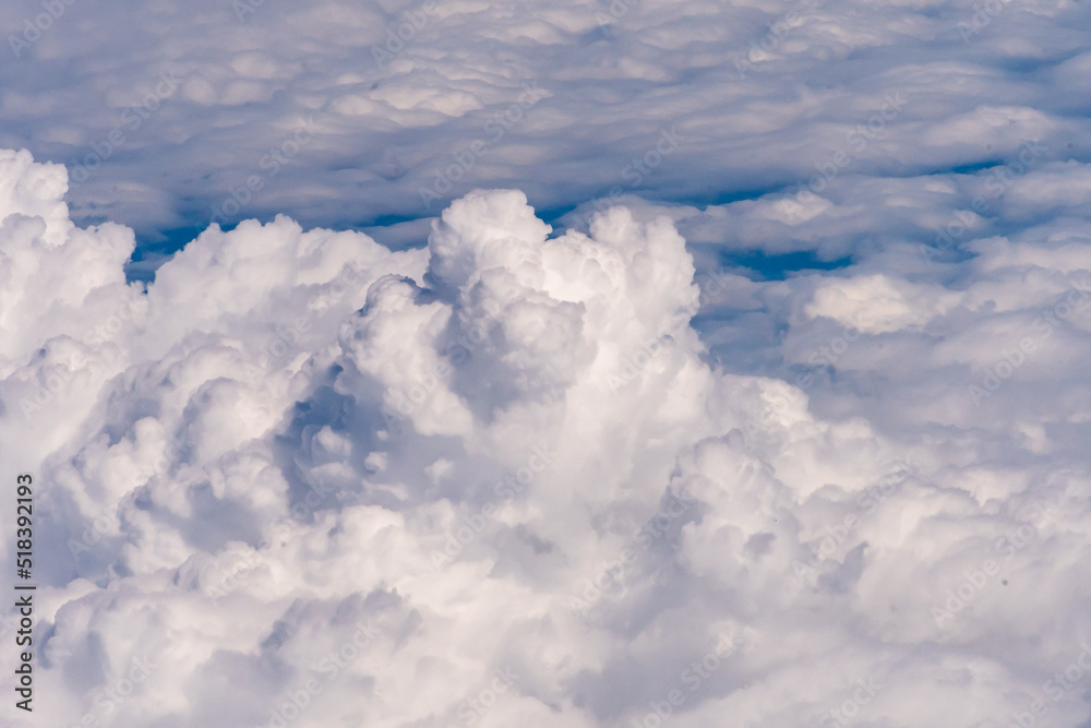 Clouds outside my airplane window from a comfortable cruising altitude Clouds outside my airplane window from a comfortable cruising altitude