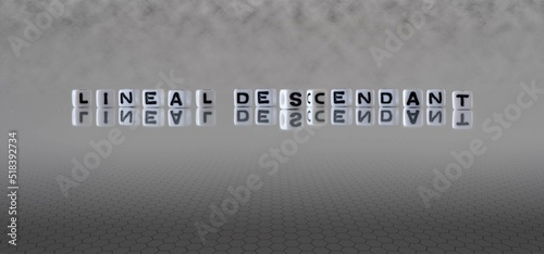 Fotografia lineal descendant word or concept represented by black and white letter cubes on