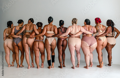 Back view of ten diverse women in underwear