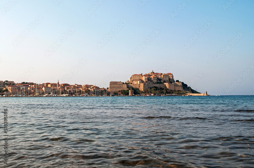 Castle in the town of Calvi on the island of Corsica in France on a rock above the sea at sunset. Castle in the town of Calvi on the island of Corsica in France on a rock above the sea at sunset.