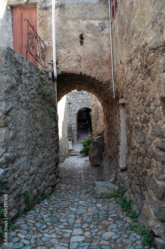 Fototapeta Naklejka Na Ścianę i Meble -  Sant Antonino, France - 06 August 2012: Narrow old stone streets in the small mountain town of Sant'Antonio on the island of Corsica