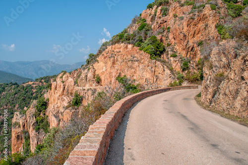 A road in the middle between two rocks on the island of Corsica (Calanche region)