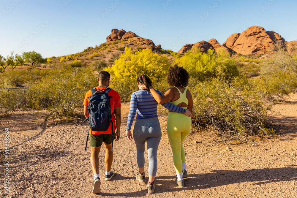 Desert  Landscape with Gen z friends arm in arm  Hiking together 