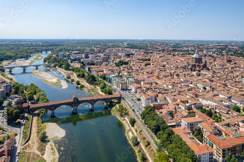 Aerial view of Pavia and the Ticino River, View of the Cathedral of Pavia, Covered Bridge. Lombardia, Italy photo