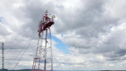 Aerial view of telecommunications cell phone tower with wireless communication antennas for network signal transmission