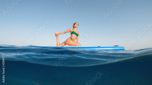 Girl on stand up paddle sup board in the sea © Polonio Video