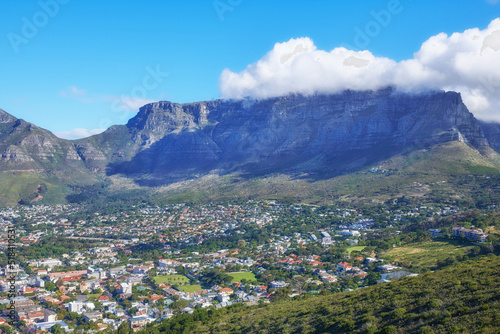 Beautiful scene of table Mountain in Cape Town on a sunny day with copy space. View of a bright sky and cloud with cityscape in South Africa. Serene harmony in nature and peaceful landscape views