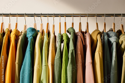 Colorful clothes hanging in row