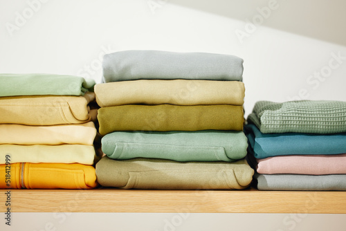 Many cotton clothes on table