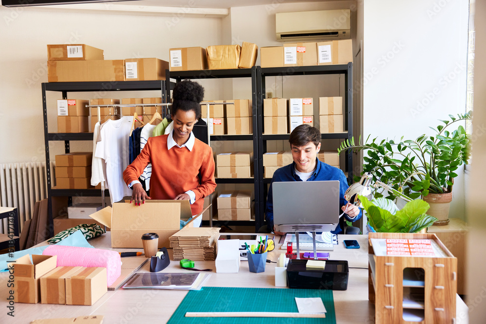 Young diverse colleagues working in delivery office