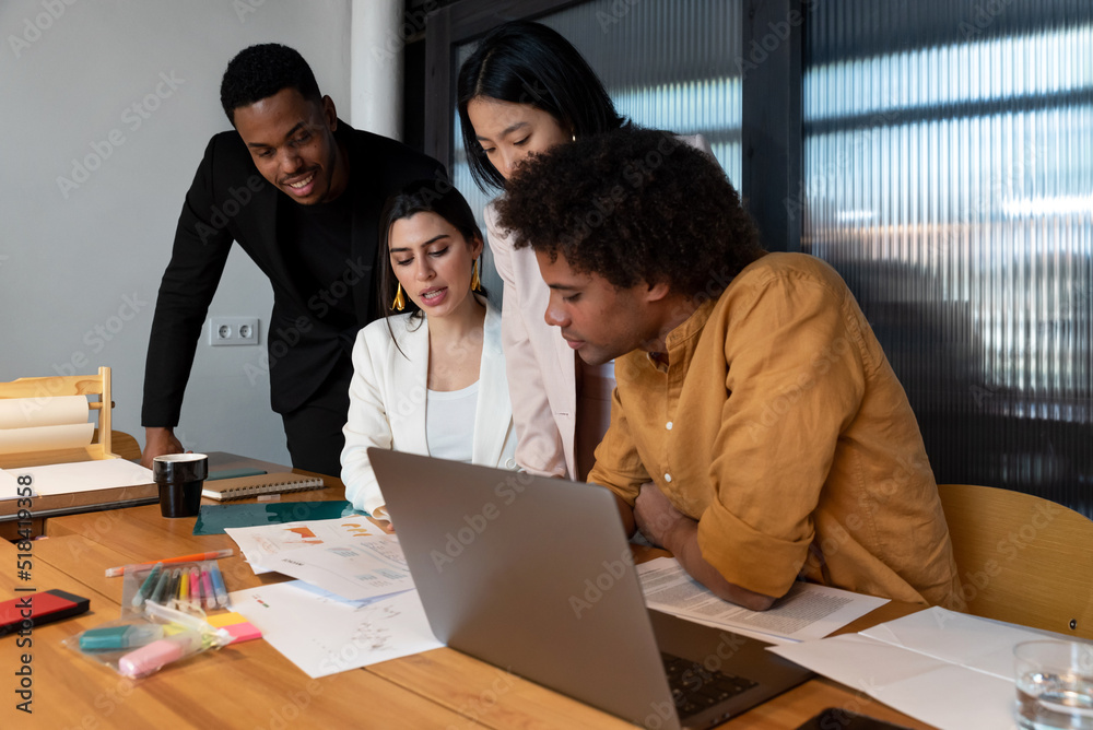 Diverse employees working in office Diverse employees working in office