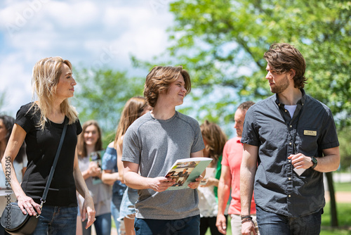 Tour: Guide Talks To Prospective Student While Walking