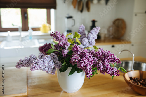 Big  fresh bouquet of lilac at home photo