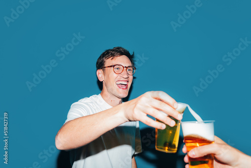 Man Holding Glass of Beer photo