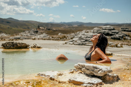 woman in an outdoor hot spring