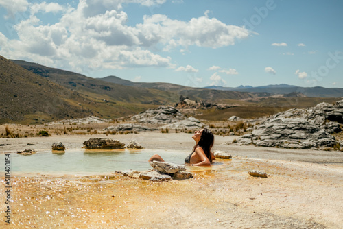 woman in an outdoor hot spring