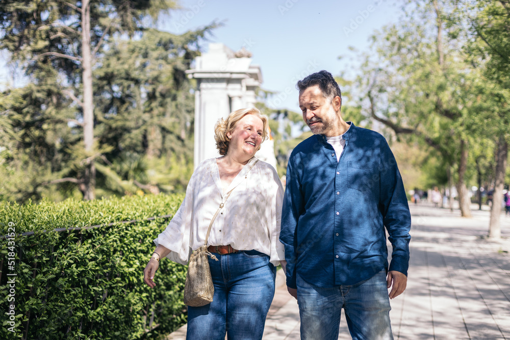 Middle-aged couple walking in the city Middle-aged couple walking in the city