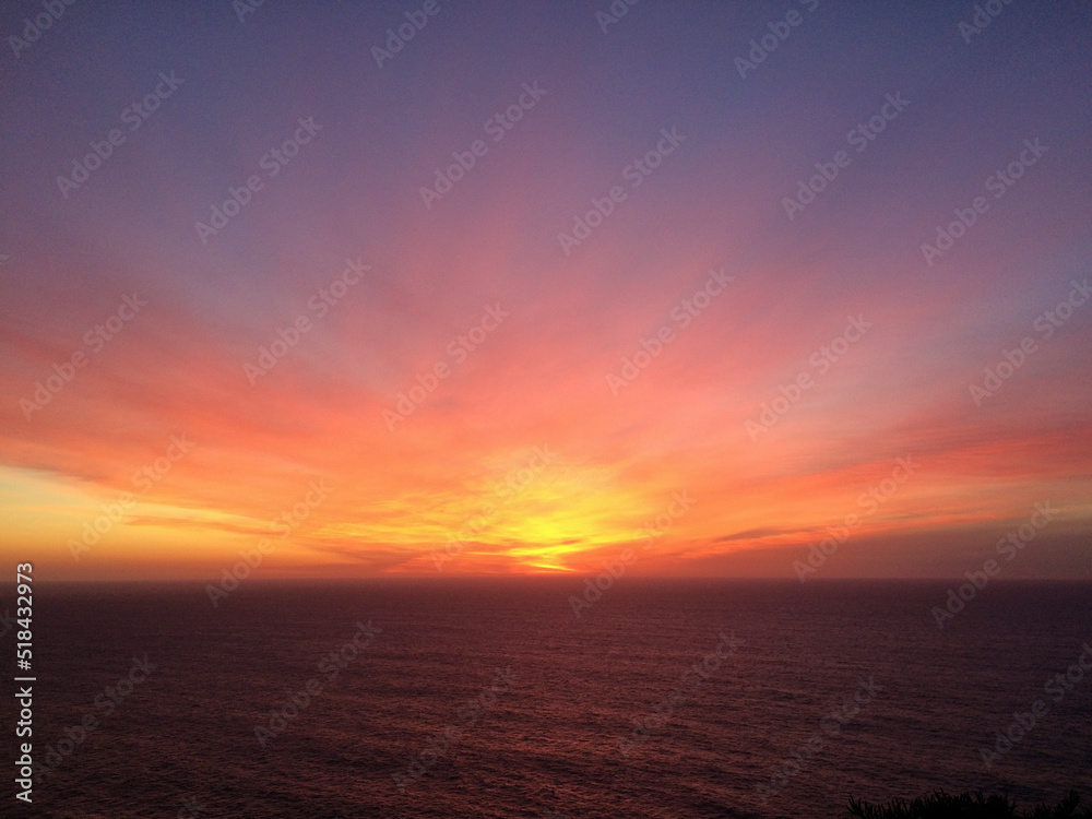dramatic color of a sunset sky over the sea dramatic color of a sunset sky over the sea
