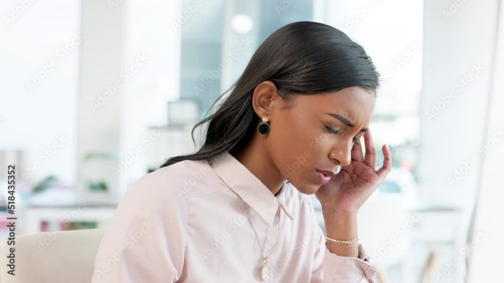 Stressed out young business woman suffering from a headache, feeling unwell and working in the office. Black corporate professional struggling with a migraine and feeling the pressure of deadlines Stressed out young business woman suffering from a headache, feeling unwell and working in the office. Black corporate professional struggling with a migraine and feeling the pressure of deadlines
