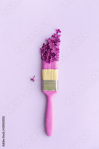 Paintbrush with lilac flowers photo
