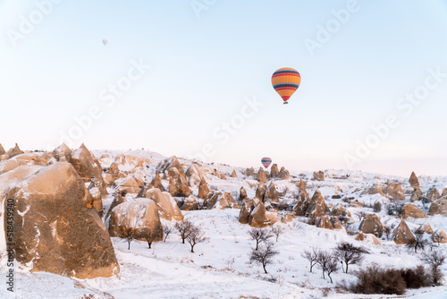 Hot air balloon above Cappadocia snow photo