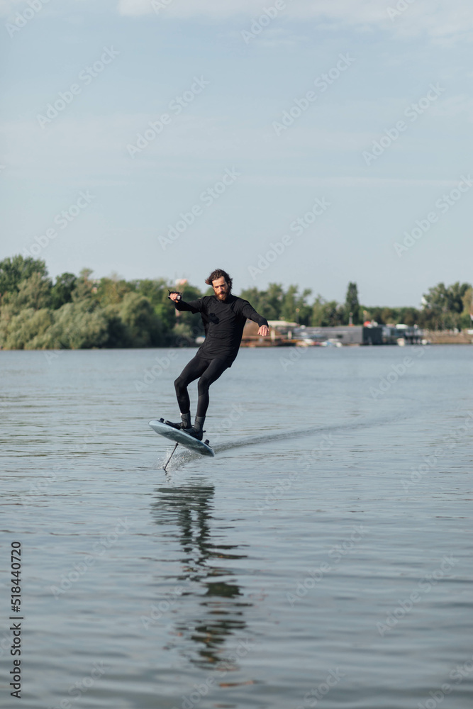 Surfer e-foil day city river Surfer e-foil day city river
