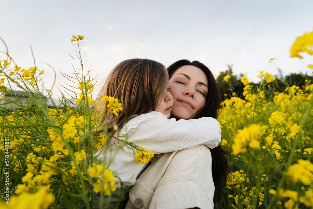 Loving Child Hugging Her Mom