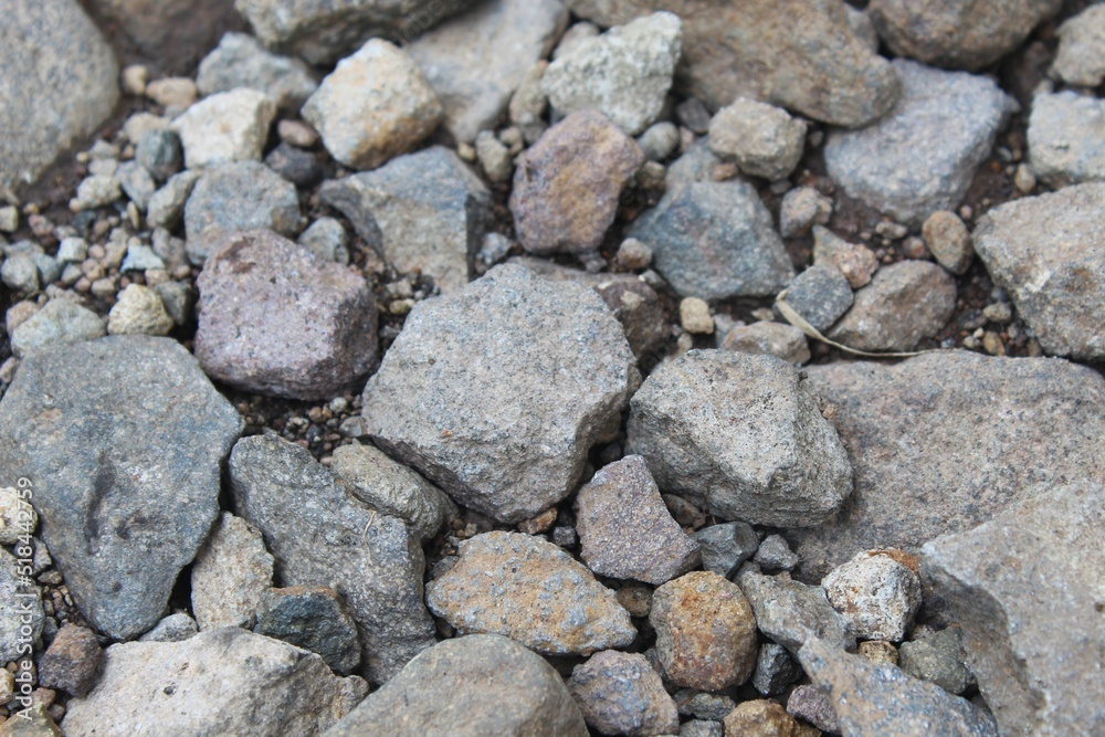 rocks on the road of different sizes and colors