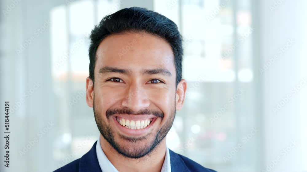 Closeup of laughing software engineer looking forward with confidence after developing a foolproof system that cannot be hacked. Portrait of a proud, young manager or technology expert standing alone