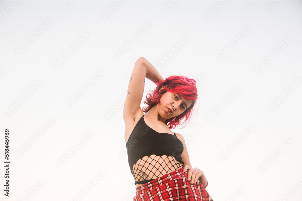Non-binary person posing for portrait Non-binary person posing for portrait