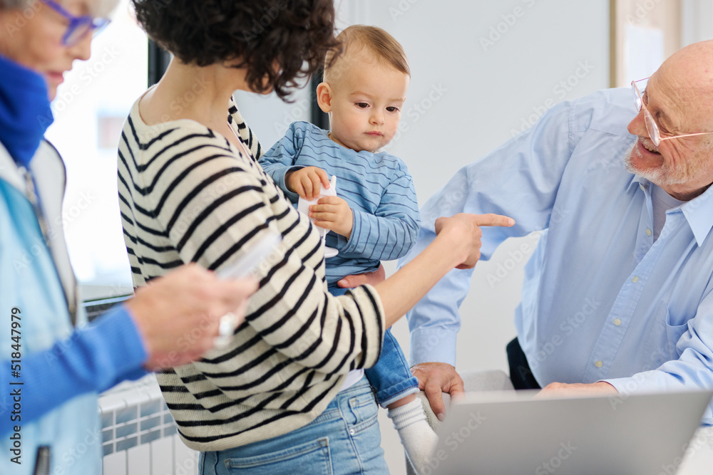 Mother and granddad communicating with baby Mother and granddad communicating with baby