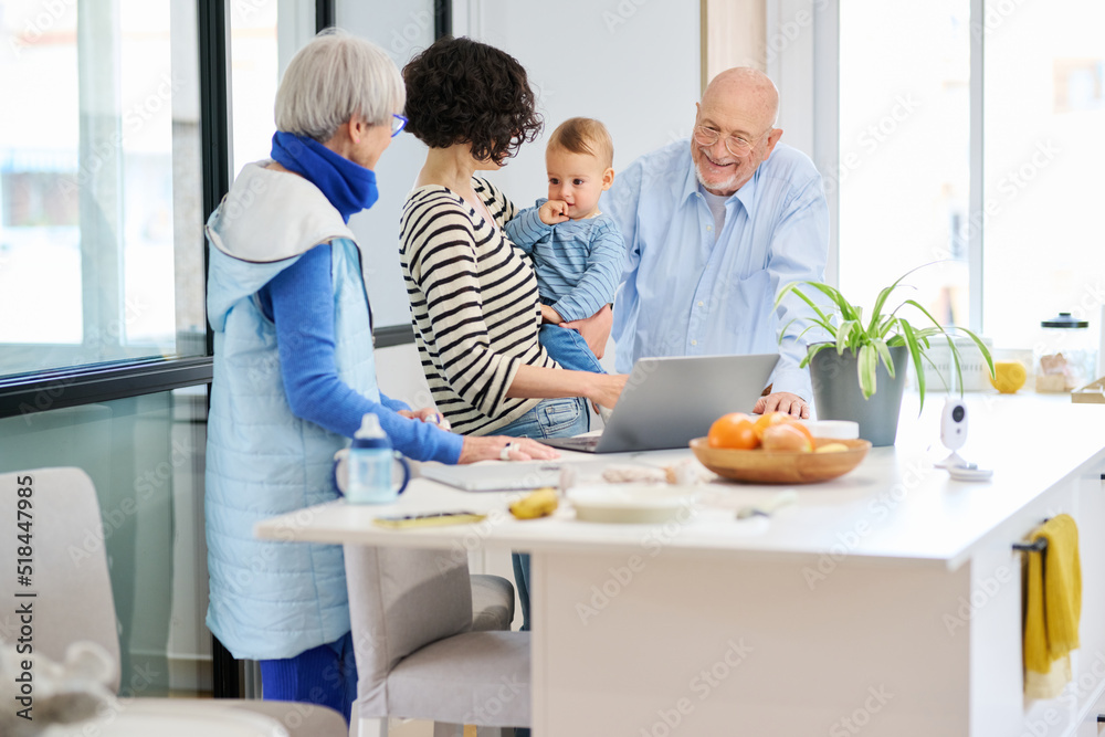 Multi generational family in kitchen Multi generational family in kitchen