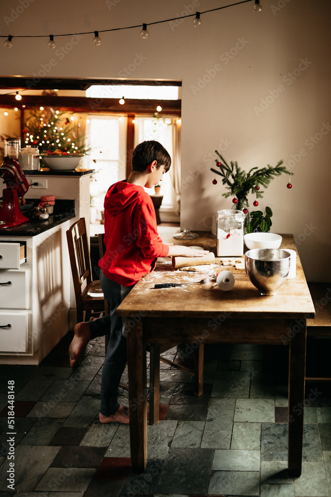 boy making shortbread cookies for Christmas boy making shortbread cookies for Christmas