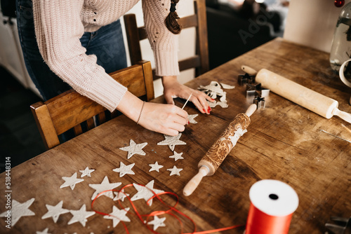 young woman creating clay stars