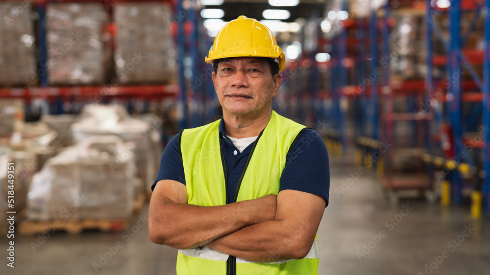 senior male warehouse worker Work at a distribution center looking at camera Standing at a large warehouse, the new arrival of additional items in the warehouse department. Employees , organize senior male warehouse worker Work at a distribution center looking at camera Standing at a large warehouse, the new arrival of additional items in the warehouse department. Employees , organize