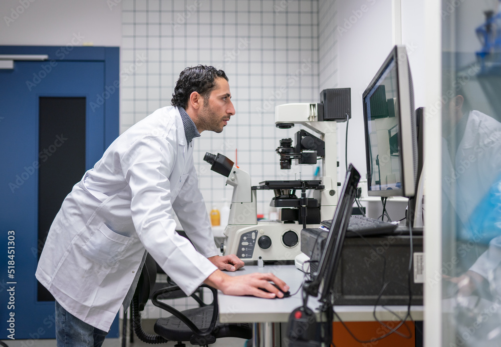 Researcher Analysing Data In The Computer