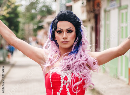 Portrait of trans man stretching out his arms photo