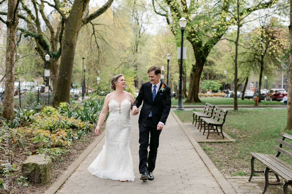 Happy Wedding Couple Strolling through Park Happy Wedding Couple Strolling through Park